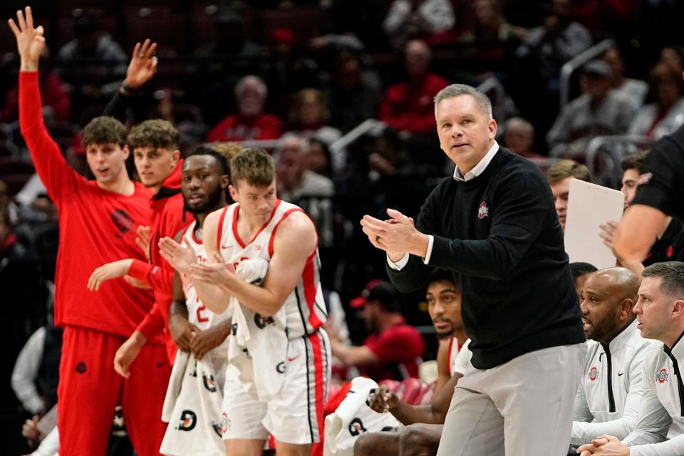 Nov 16, 2022; Columbus, OH, USA;  Ohio State Buckeyes head coach Chris Holtmann applauds his team during the first half of the NCAA men's basketball game against the Eastern Illinois Panthers at Value City Arena. Mandatory Credit: Adam Cairns-The Columbus Dispatch