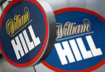 FILE PHOTO: A branded sign is displayed outside a William Hill betting shop in London, Britain July 25, 2016. REUTERS/Neil Hall/File Photo