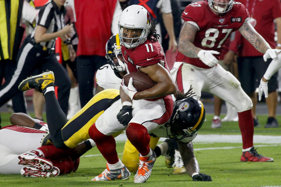 Arizona Cardinals wide receiver Larry Fitzgerald (11) is hit by Pittsburgh Steelers outside linebacker Bud Dupree during the first half of an NFL football game, Sunday, Dec. 8, 2019, in Glendale, Ariz. (AP Photo/Ross D. Franklin)