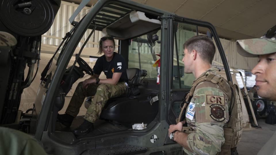 Maj. Ben Rofe, 321st Contingency Response Squadron director of operations, coordinates cargo movement with a Royal Canadian Air Force member during Mobility Guardian 23 at Andersen Air Force Base, Guam, July 8. (Staff Sgt. Malissa Lott/Air Force)