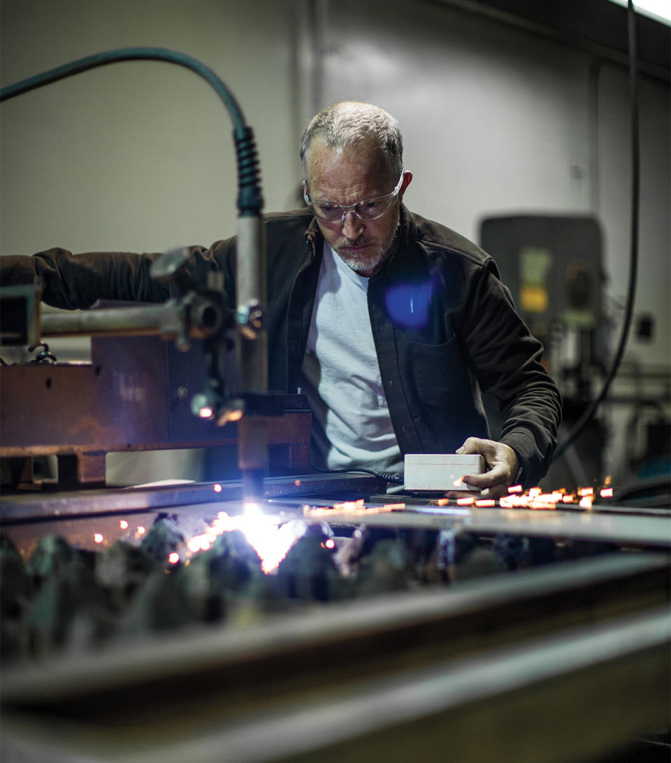 Jonathan Ward plasma-cuts steel for a prototype part