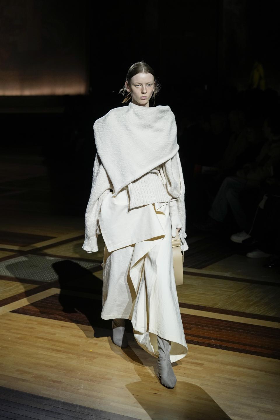 A model wears a creation as part of the Issey Miyake Fall/Winter 2024-2025 ready-to-wear collection presented Friday, March 1, 2024 in Paris. (Photo by Scott A Garfitt/Invision/AP)