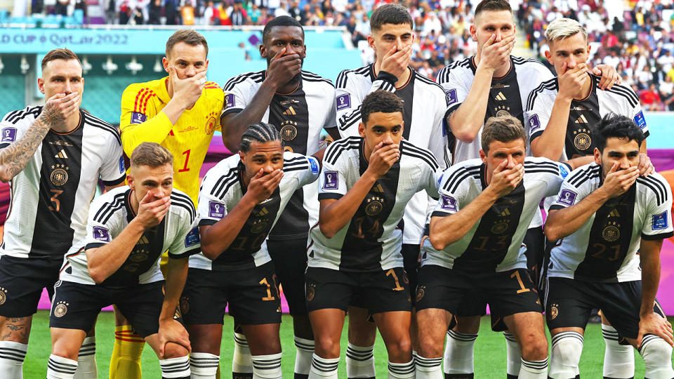 Germany&#39;s football team cover their mouths ahead of their World Cup clash against Japan.