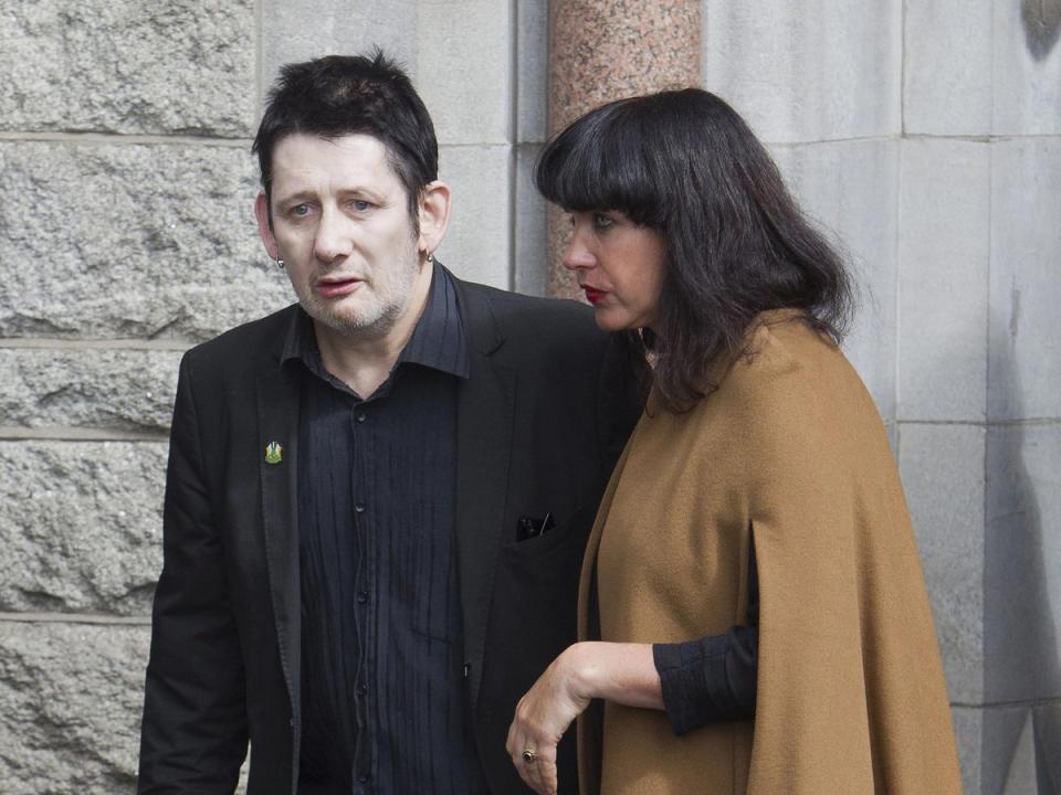 MacGowan with his partner Victoria Clarke after the funeral of the Nobel Laureate poet Seamus Heaney in  Donnybrook, Dublin (PA)