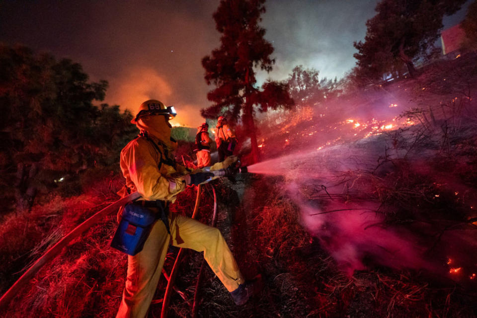 Firefighters work near Getty Center in Los Angeles Oct. 28, 2019. Thousands of residents were forced to evacuate their homes after a fast-moving wildfire erupted early Monday morning near the famous Getty Center. | Xinhua News Agency—Xinhua News Agency/Getty Images