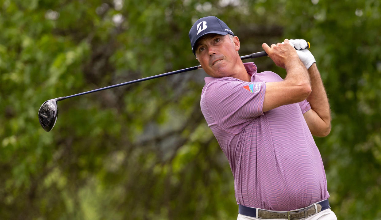  Kuchar watches his tee shot after striking a driver 