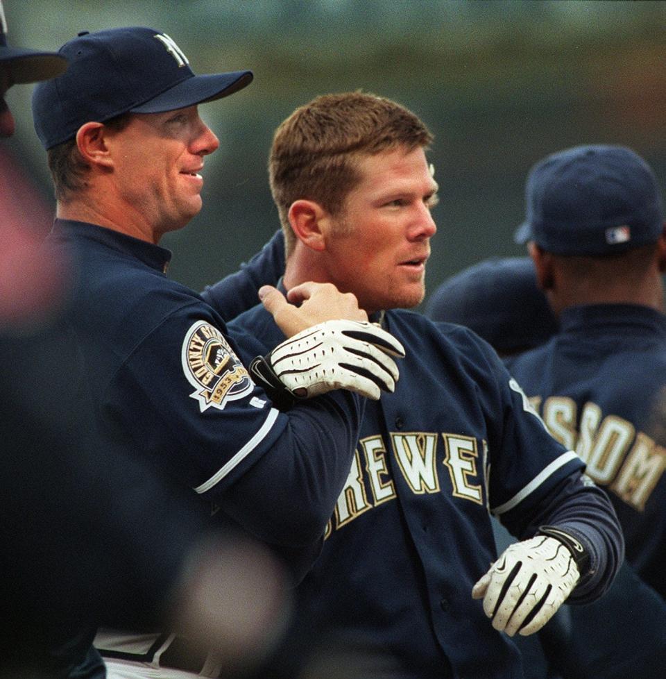 Geoff Jenkins is hugged by teammates after delivering the game winning hit in the ninth inning to help beat the Chicago Cubs, 5-4, on Saturday, April 17, 1999.