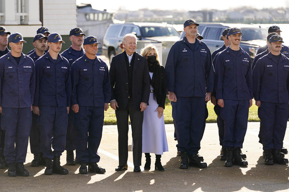 President Joe Biden and first lady Jill Biden pose for a photo with members of the coast guard at the United States Coast Guard Station Brant Point in Nantucket, Mass., Thursday, Nov. 25, 2021.  - Credit: AP