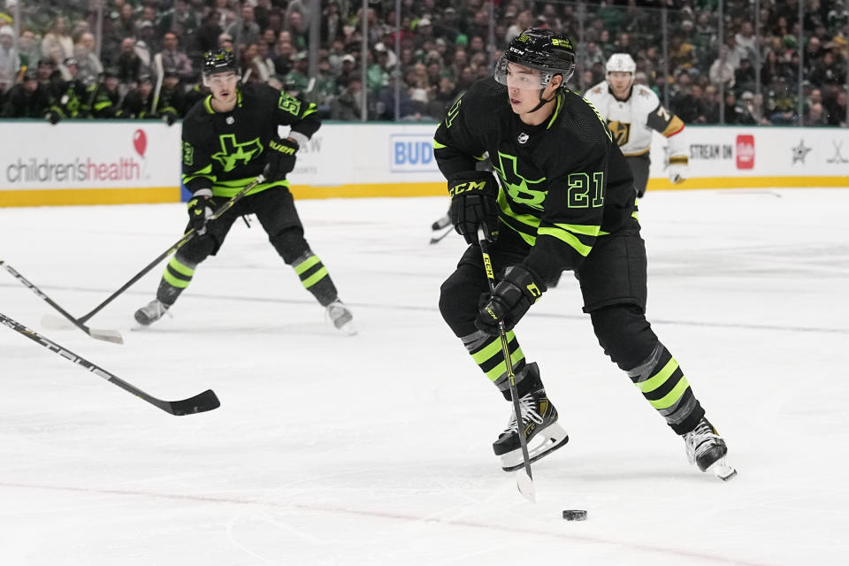 Dallas Stars left wing Jason Robertson (21) skates with the puck before taking a shot against the Vegas Golden Knights during the first period of an NHL hockey game, Wednesday, Nov. 22, 2023, in Dallas. (AP Photo/Tony Gutierrez)