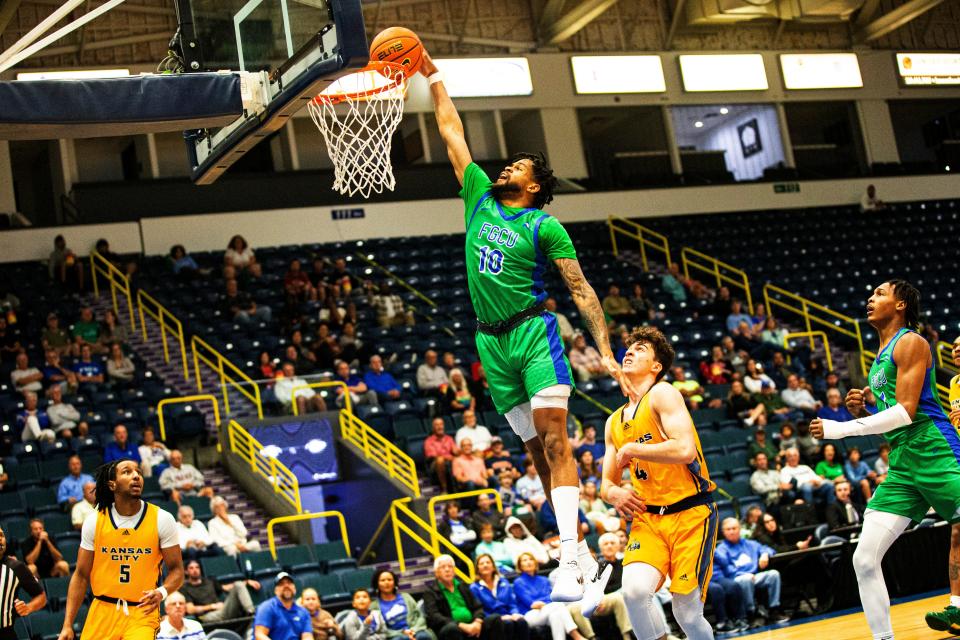 FGCUÕs Zach Anderson dunks the ball against Kansas City in the final game of the Gulf Coast Showcase at Hertz Arena. FGCU won the tournament. 