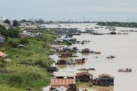 Floating houses are seen on the Tonle Sap River in Prek Pnov district