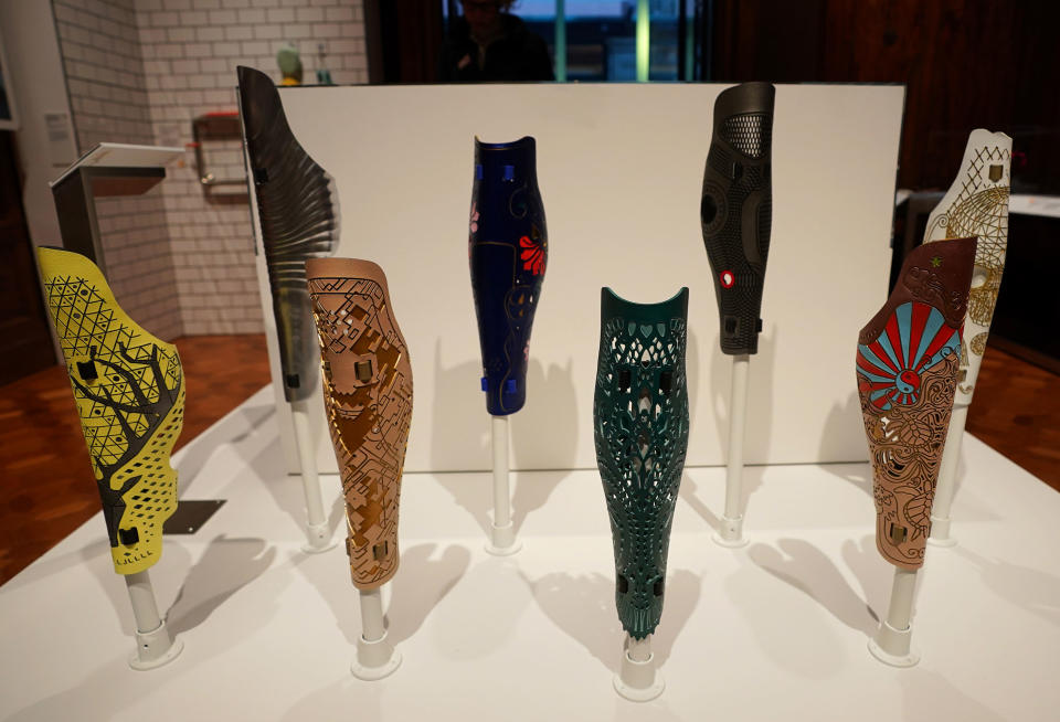 A group of prosthetic leg covers are displayed as part of the Access+Ability exhibit at the Cooper Hewitt Smithsonian Design Museum