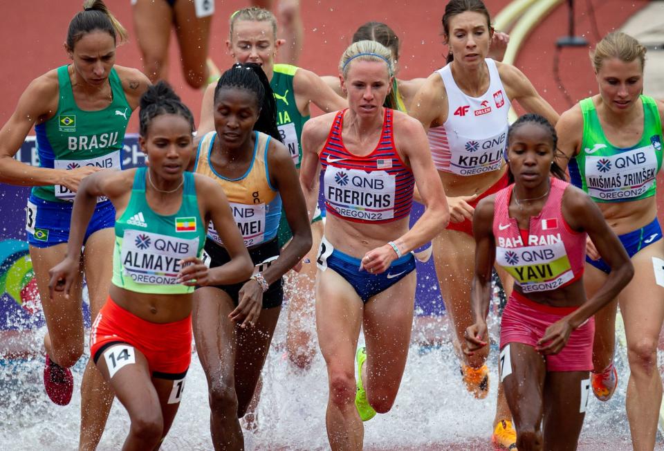 USA's Courtney Frerichs, center, advances out of her heat of the women's 3,000 meter steeplechase during day two of the World Athletics Championships at Hayward Field in Eugene, Oregon July 16, 2022. 