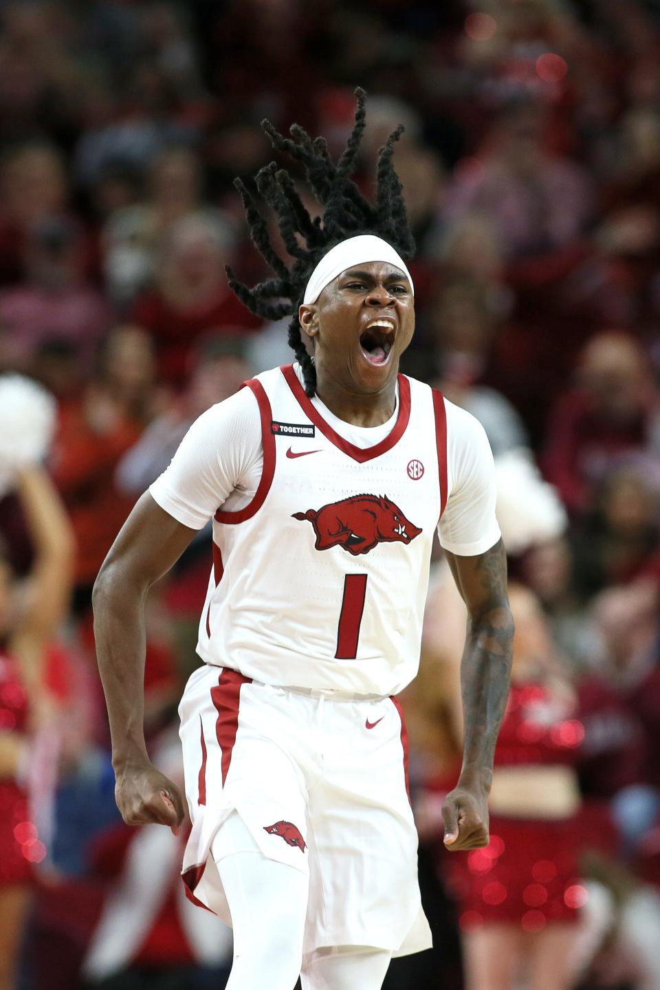 Dec 30, 2023; Fayetteville, Arkansas, USA; Arkansas Razorbacks guard Keyon Menifield Jr (1) celebrates after a play in the first half against the UNC Wilmington Seahawks at Bud Walton Arena. Mandatory Credit: Nelson Chenault-USA TODAY Sports