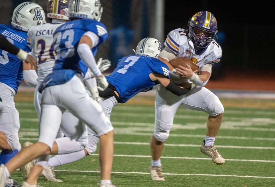 Escalon's Joshua Graham, right, is tackled by Acalanes' Gavin Bender during the 2023 CIF Div. 3-AA State Football Championship semifinal game at Acalanes High School in Lafayette in Dec. 1, 2023. Acalanes won 49-14.