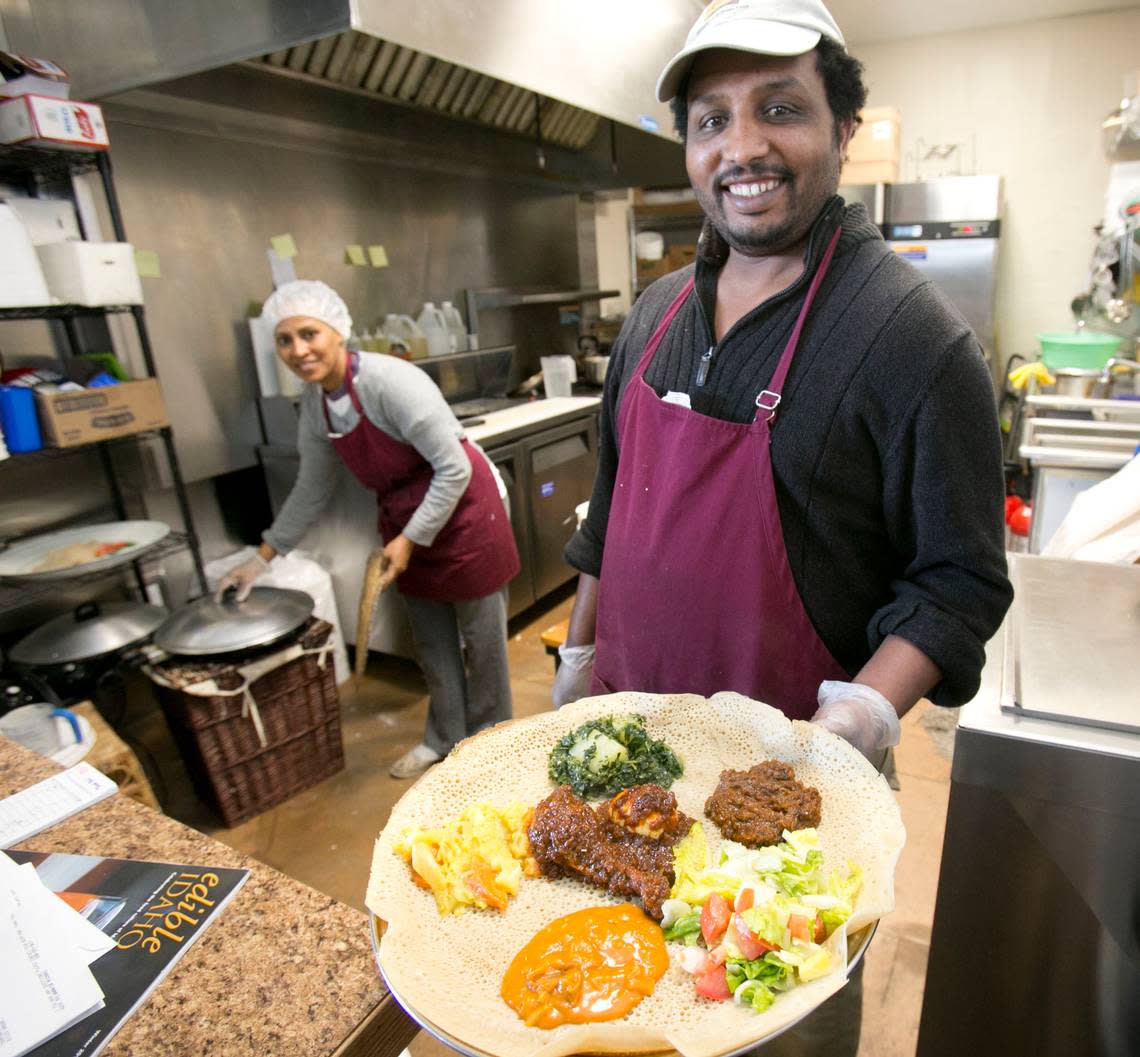 In this 2015 file photo, Kibrom Milash serves Ethiopian and Eritrean food at the Boise International Market.