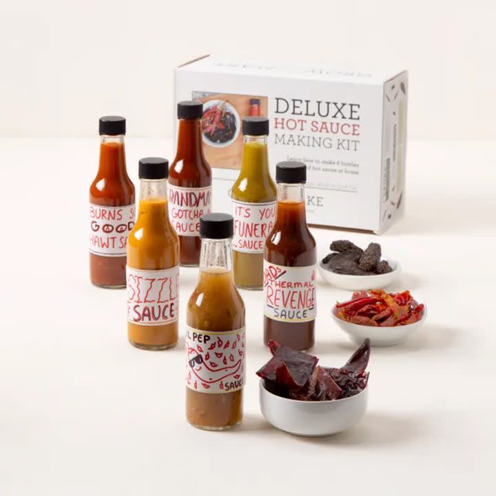 Make Your Own Hot Sauce Kit with dried chiles, glass bottles, and labels