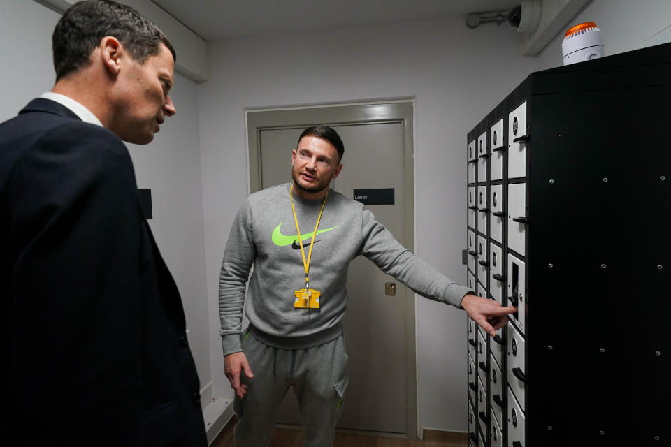 An inmate demonstrates the medication collection point to Secretary of State for Justice and Lord Chancellor Alex Chalk, during the official opening of HMP Fosse Way, the new Category C prison in Leicester. Picture date: Thursday June 29, 2023. (Photo by Jacob King/PA Images via Getty Images)