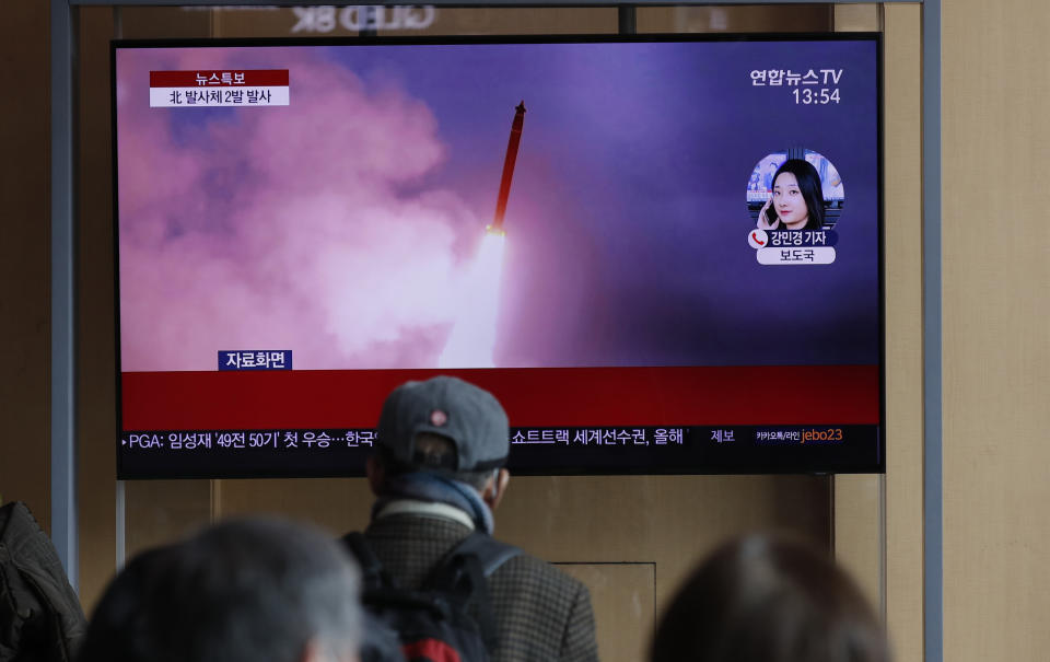 People watch a TV screen showing a news program reporting about North Korea's firing of projectiles with a file image at the Seoul Railway Station in Seoul, South Korea, Monday, March 2, 2020. North Korea fired two unidentified projectiles into its eastern sea on Monday as it begins to resume weapons demonstrations after a months-long hiatus that could have been forced by the coronavirus crisis in Asia. The Korean letters read: "Joint Chiefs of Staff, North Korea fired two projectiles." (AP Photo/Lee Jin-man)