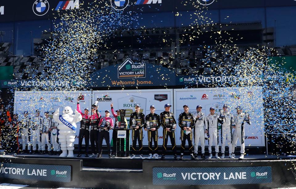 Winning teams of the GTD celebrate together in Victory Lane after the Rolex 24 at Daytona.