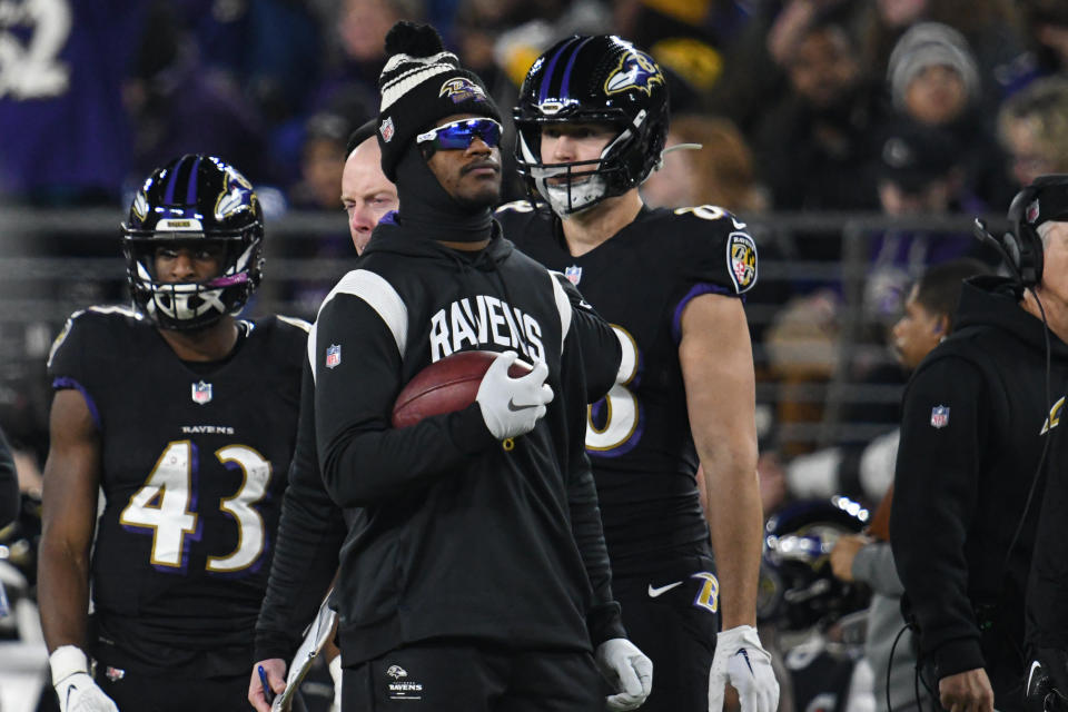 Jan 1, 2023; Baltimore, Maryland, USA; Baltimore Ravens quarterback Lamar Jackson (8) holds a ball on the sidelines during the game Pittsburgh Steelers  at M&T Bank Stadium. Mandatory Credit: Tommy Gilligan-USA TODAY Sports