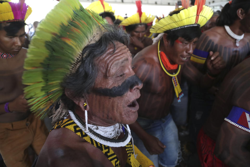 Indigenous people celebrate after a majority of Supreme Court justices ruled to enshrine their land rights in a landmark case in Brasilia, Brazil, Thursday, Sept. 21, 2023. Six of the 11 Supreme Court justices voted against establishing a cut-off date after which Indigenous peoples could not claim new territory. (AP Photo/Gustavo Moreno)