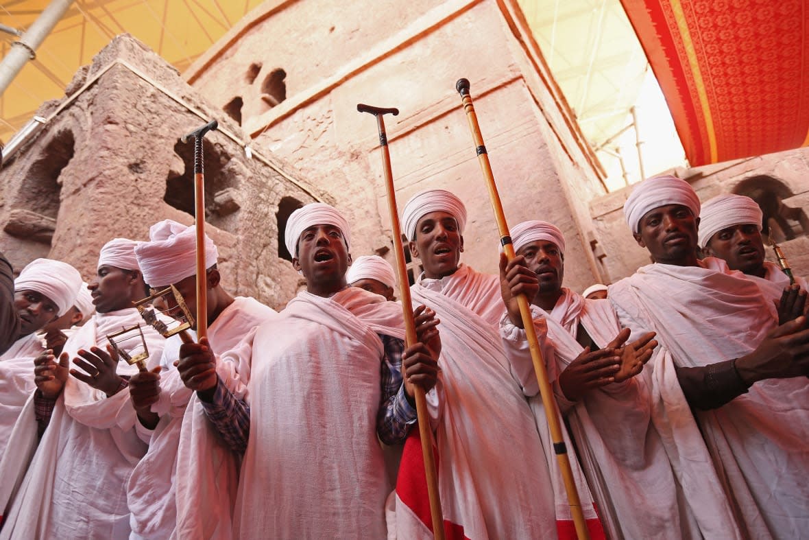 Ethiopian Orthodox priests and other clergy members peform a ritual involving song, dance and a small procession outside Bete Maryam, als called St. Mary’s, Church on the occasion of the visit of German President Joachim Gauck at the Lalibela holy sites on March 19, 2013 in Lalibela, Ethiopia. (Photo by Sean Gallup/Getty Images)