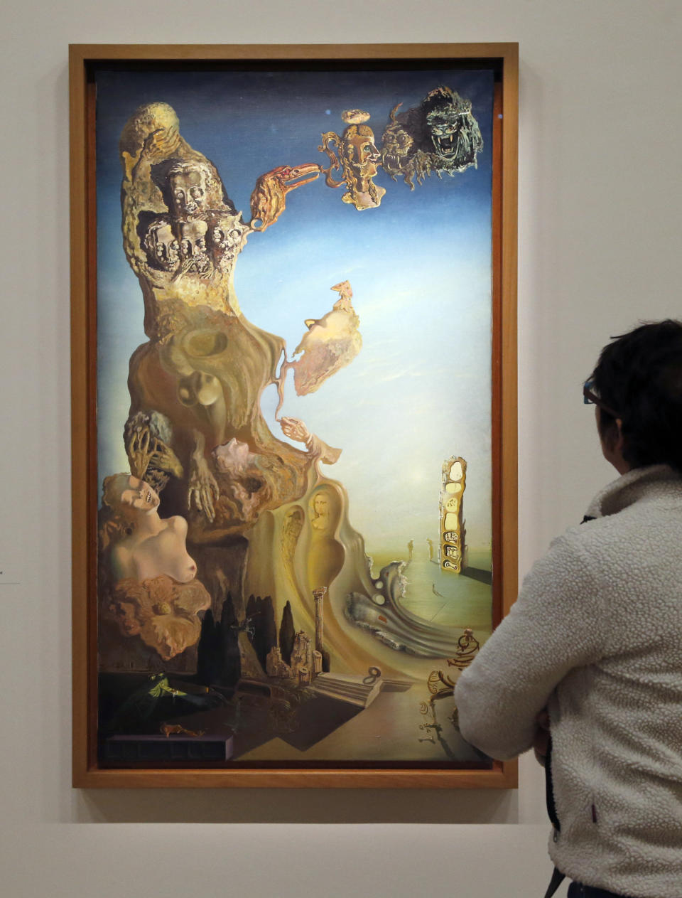 A visitor looks at a painting entitled 'Monument imperial à la femme-enfant' (Imperial Monument to the Child Woman) by Spanish surrealist artist Salvador Dali's during an exhibition devoted to his work at the Centre Pompidou contemporary art center (aka Beaubourg) on November 19, 2012 in Paris. More than 30 years after the first retrospective in 1979, the event gathers more than 200 art pieces and runs until March 13, 2013. (FRANCOIS GUILLOT/AFP/Getty Images)