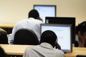 File photo dated 23/07/09 of call centre workers as fewer workers believe they are at immediate risk of redundancy amid falling unemployment, giving a