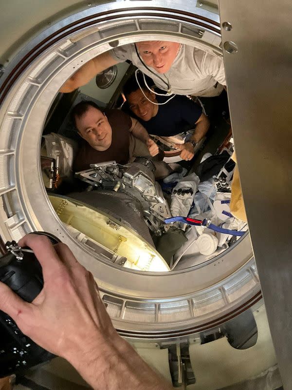 Crew pose for a picture before leaving International Space Station