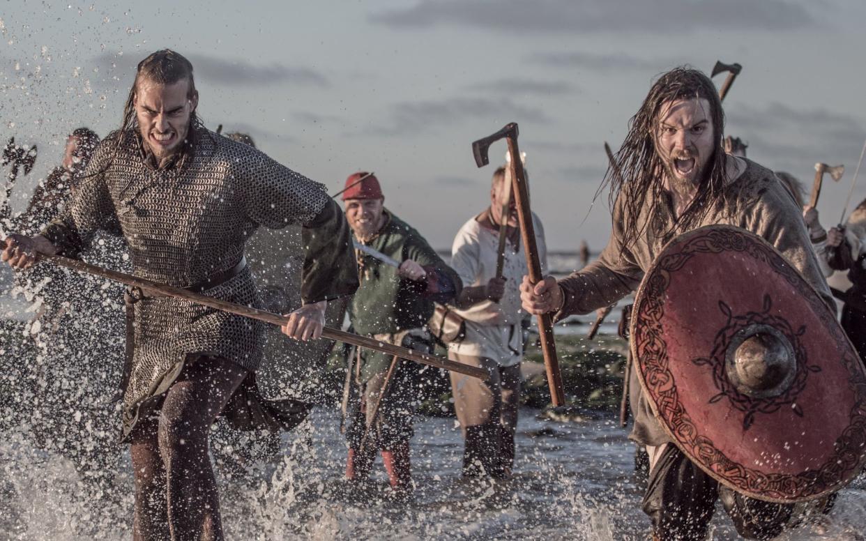 Viking warriors storming ashore