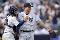 New York Yankees starting pitcher Gerrit Cole, right, celebrates with catcher Jose Trevino, left, after closing the ninth inning of a baseball game against the Minnesota Twins to record a complete game shutout, Sunday, April 16, 2023, in New York. (AP Photo/John Minchillo)