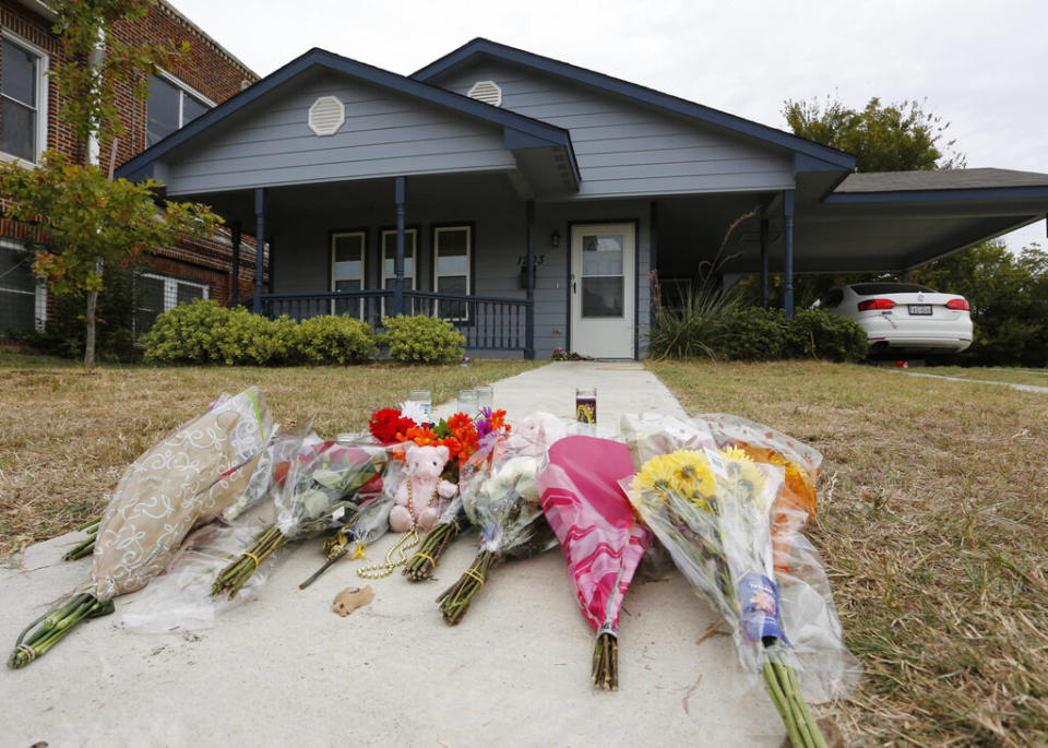 Flowers lie on the sidewalk in front of the house in Fort Worth, Texas, where police officer Aaron Dean shot and killed Atatiana Jefferson, a Black woman, through a back window of her home.