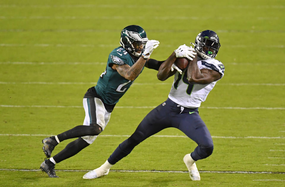 Nov 30, 2020; Philadelphia, Pennsylvania, USA; Seattle Seahawks wide receiver DK Metcalf (14) makes a catch against Philadelphia Eagles cornerback Darius Slay (24) during the third quarter at Lincoln Financial Field. Mandatory Credit: Eric Hartline-USA TODAY Sports