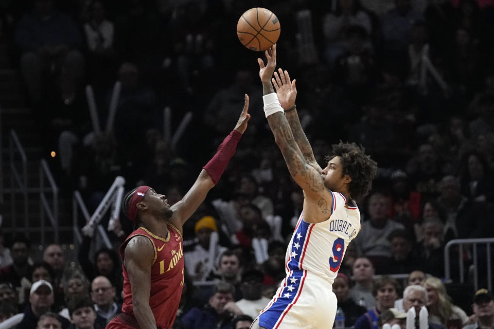 Philadelphia 76ers guard Kelly Oubre Jr. (9) shoots over Cleveland Cavaliers guard Caris LeVert, left, in the second half of an NBA basketball game, Monday, Feb. 12, 2024, in Cleveland. (AP Photo/Sue Ogrocki)