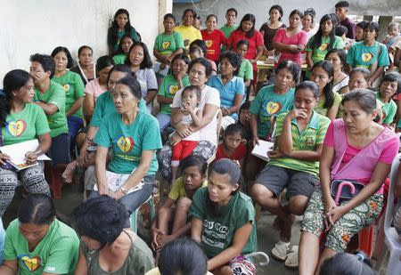 Typhoon Hagupit victims attend an anti-trauma session in San Julian, Eastern Samar in central Philippines December 9, 2014 REUTERS/Erik De Castro