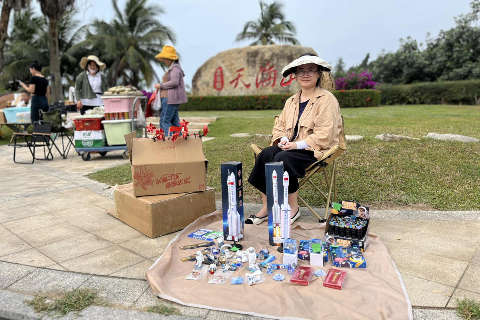 A street vendor selling space merchandise ahead of the lunar launch on Friday. (Janis Mackey Frayer)