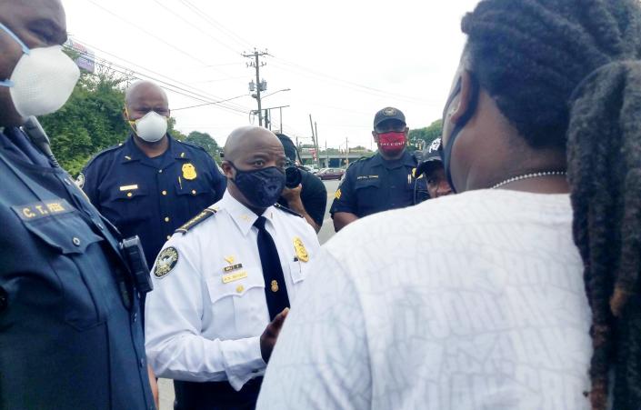 Lady A, an organizer of the Rayshard Brooks Peace Camp, speaks to the Atlanta Police Department&#x27;s interim police chief