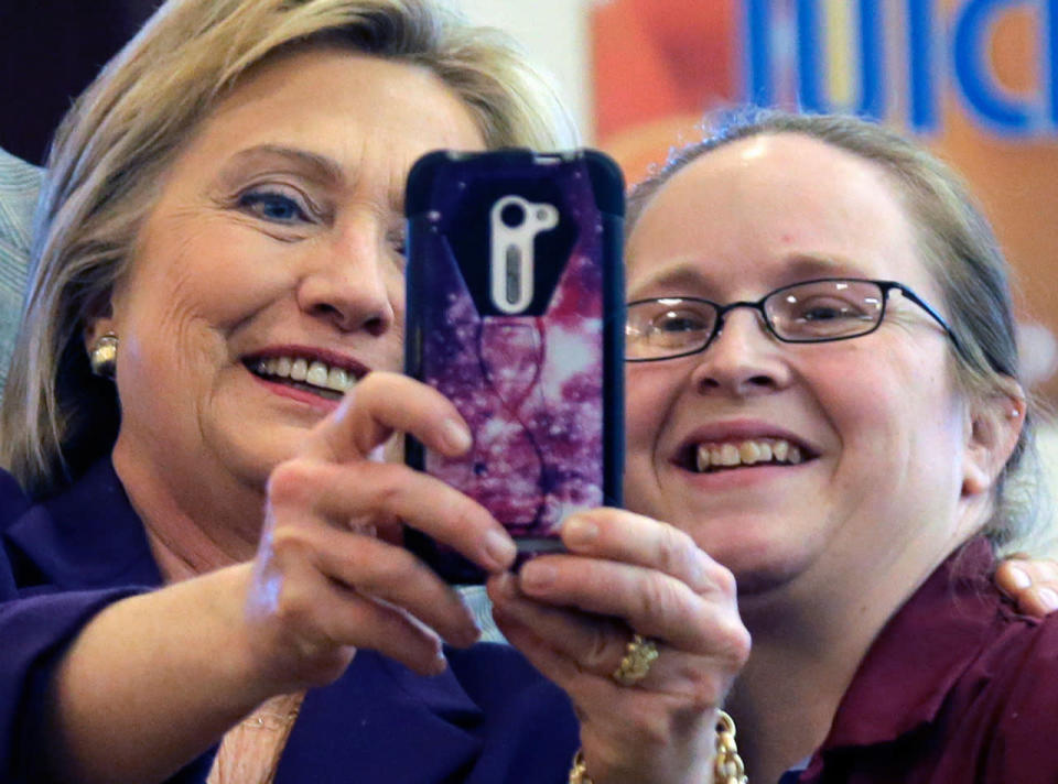 Hillary holds the phone