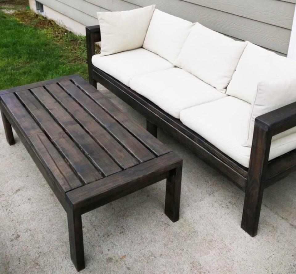 Dark wooden patio table and chair.