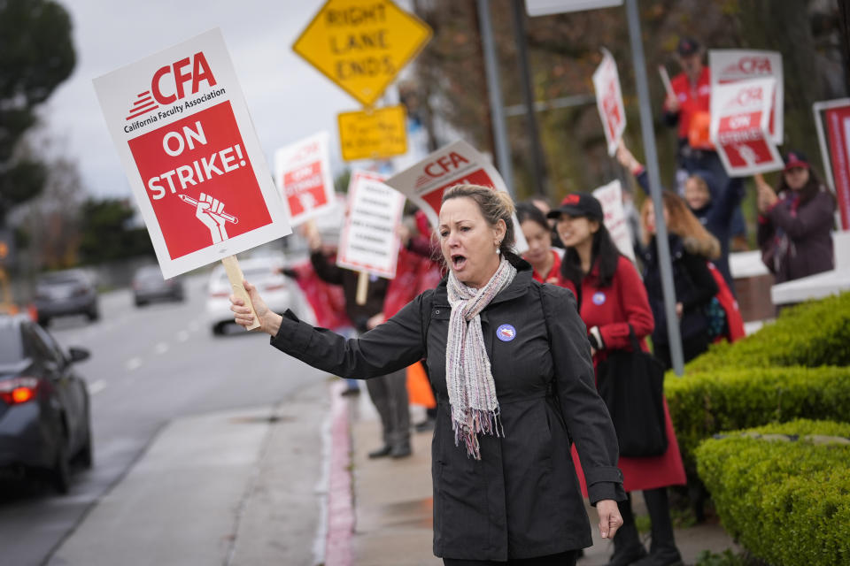 Michele Bartlett, a professor in the social work department, pickets outside the Cal State Northridge campus Sunday, Jan. 21, 2024, in Northridge, Calif. More than 30,000 professors, librarians, plumbers, electricians, and other workers at California State University, the largest public university system in the U.S., have started a weeklong strike on Monday to demand higher wages. (AP Photo/Marcio Jose Sanchez)