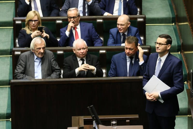 Poland's Prime Minister Morawiecki waits before speaking in parliament in Warsaw