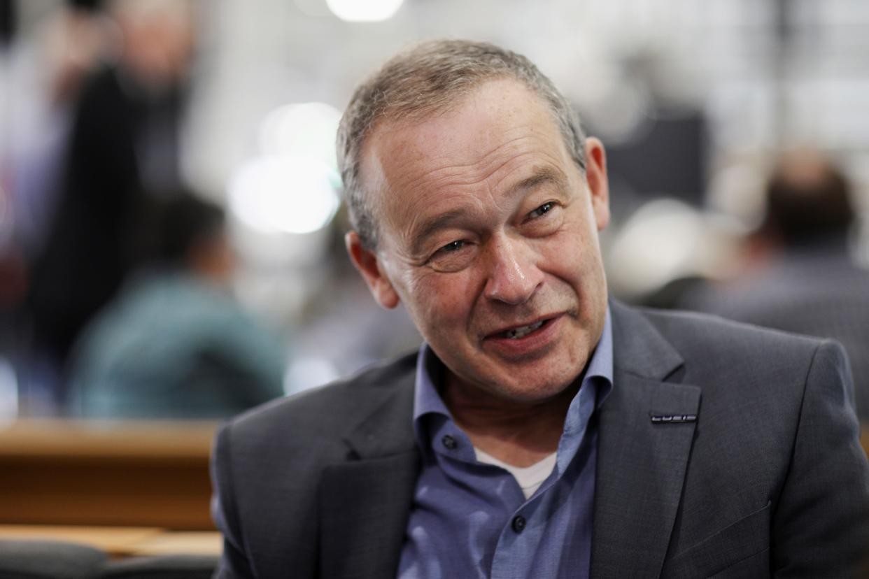 CEO Peter Rawlinson speaks with a reporter at the Lucid Motors plant in Casa Grande, Arizona, U.S. September 28, 2021.