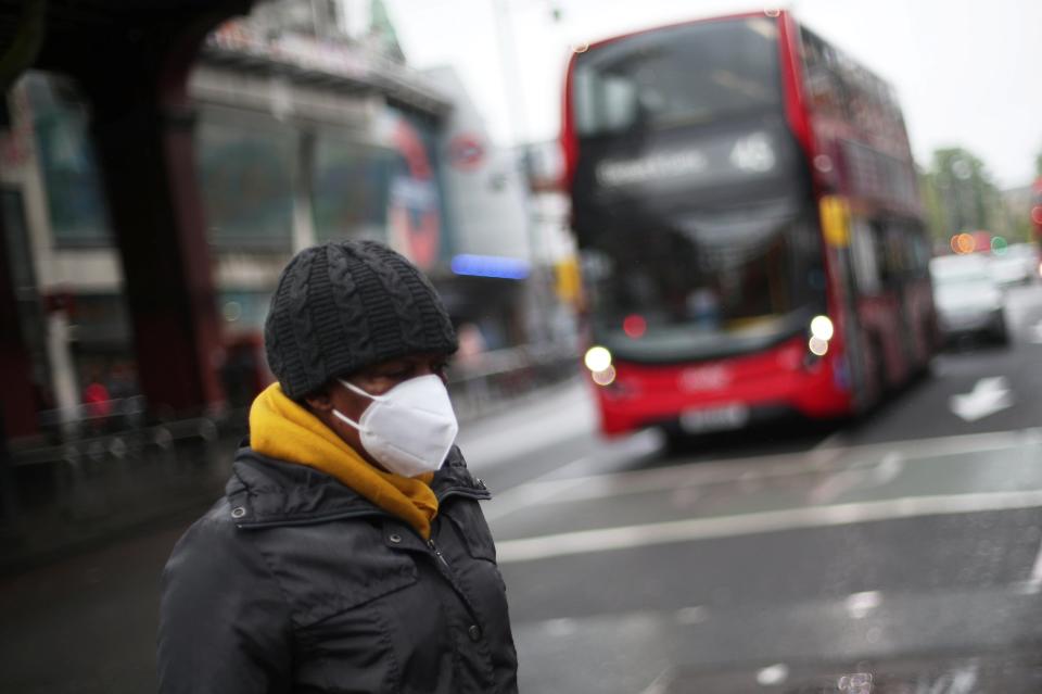 A Londoner wearing a mask (REUTERS)