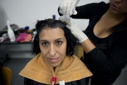 Rocio Ramirez, 40, from Guanajuato, Mexico, receives beauty treatment as part of a workshop on sexuality held at the Cultural Centre of Spain in Mexico City on October 30, 2012. Ramirez has been taking antiretroviral drugs since 1997 to combat HIV/AIDS