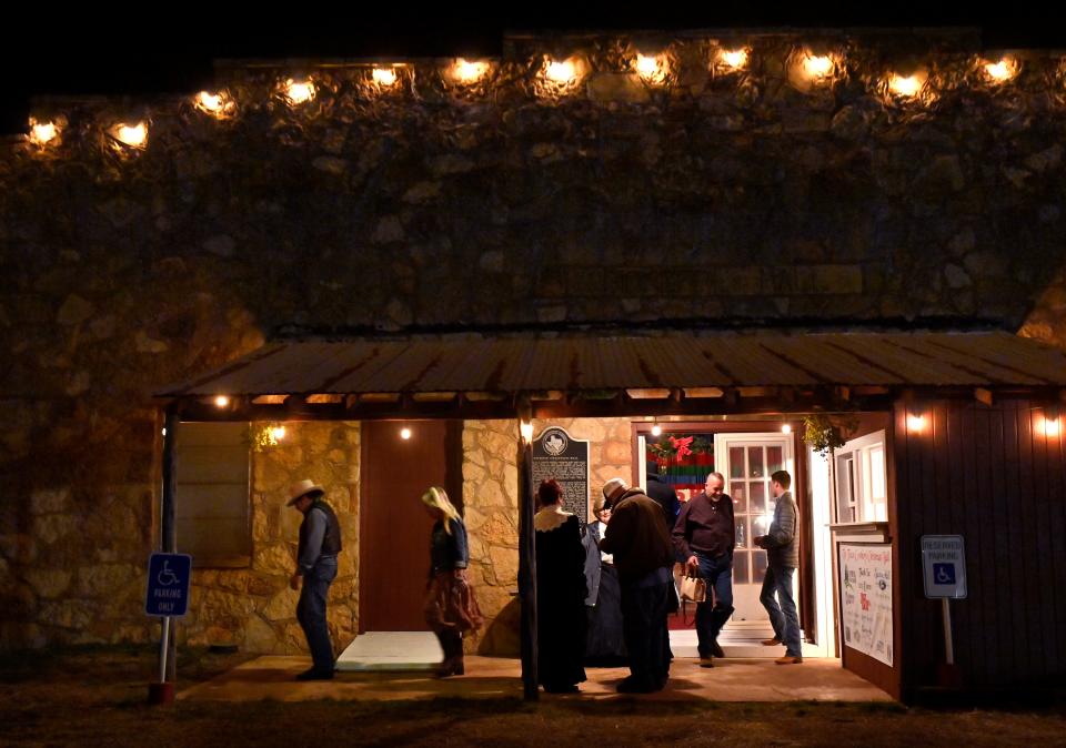 Visitors stand outside Pioneer Hall in Anson as they await the start of the Texas Cowboy’s Christmas Ball on Dec. 14.