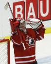 Canada's goalie Zachary Fucale raises his arms after Canada defeated the United States in their IIHF World Junior Championship ice hockey game in Malmo, Sweden, December 31, 2013. REUTERS/Alexander Demianchuk (SWEDEN - Tags: SPORT ICE HOCKEY)