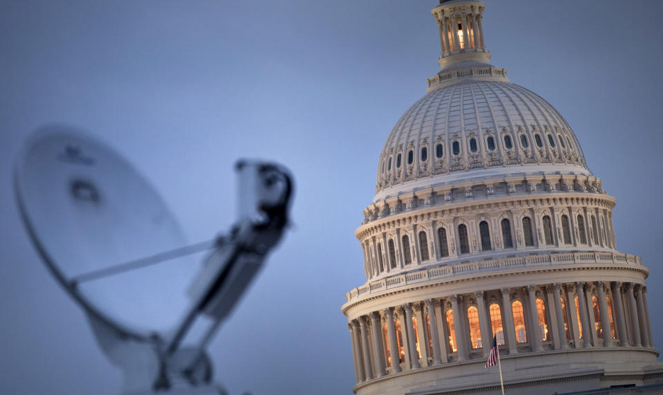 A view of the U.S. Capitol's rotunda and a TV truck's satellite dish before the State of the Union address on Capitol Hill January 25, 2011 in Washington, D.C. (Photo by Brendan Smialowski/Getty Images)