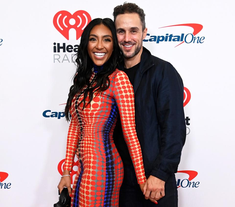 (L-R) Tayshia Adams and Zac Clark attend the 2021 iHeartRadio Music Festival on September 18, 2021 at T-Mobile Arena in Las Vegas, Nevada.