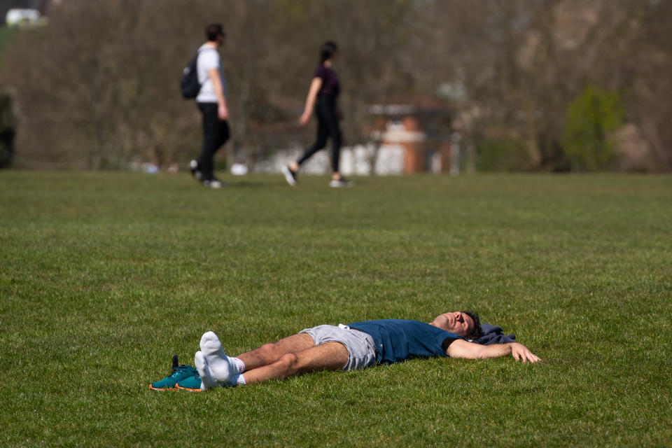 Members of the public sunbathe in Regents Park, London, as the UK continues in lockdown to help curb the spread of the coronavirus.